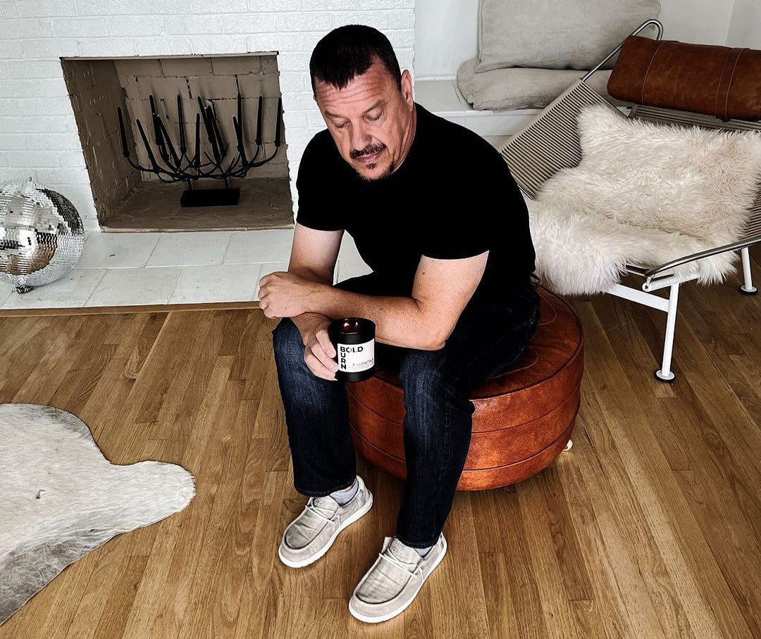 Jeff Roberts - founder of Bold Burn Candles holding a candle